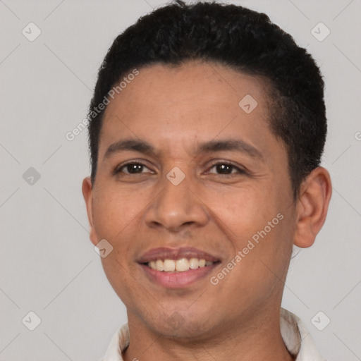 Joyful latino young-adult male with short  brown hair and brown eyes