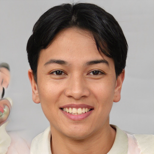Joyful asian young-adult female with short  brown hair and brown eyes