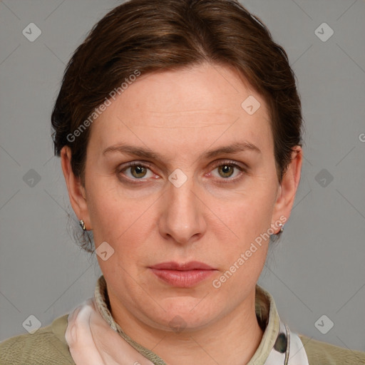 Joyful white adult female with medium  brown hair and blue eyes