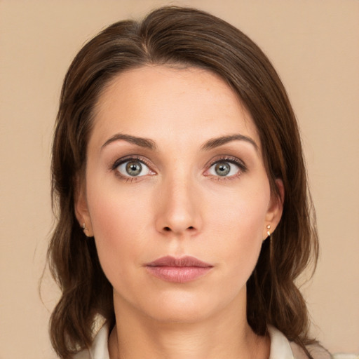 Neutral white young-adult female with medium  brown hair and green eyes