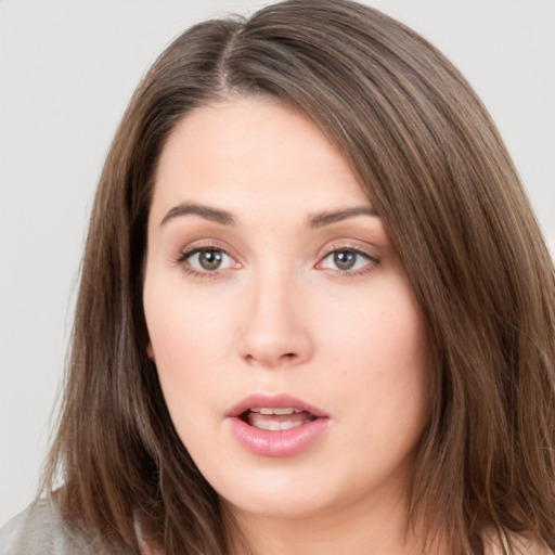 Neutral white young-adult female with long  brown hair and brown eyes