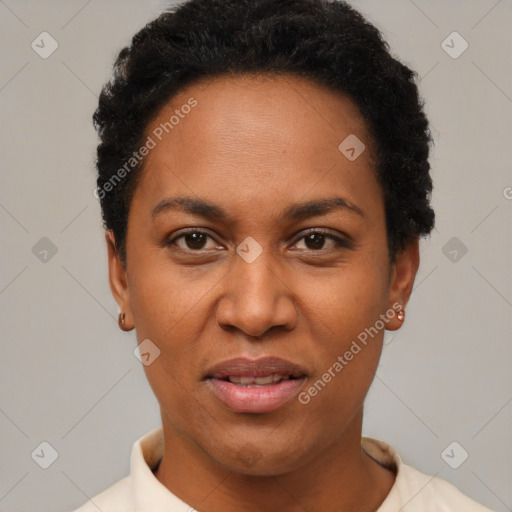 Joyful black young-adult female with short  black hair and brown eyes