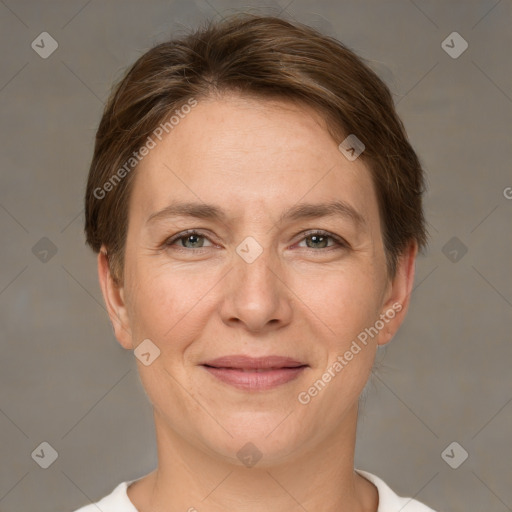 Joyful white adult female with short  brown hair and grey eyes