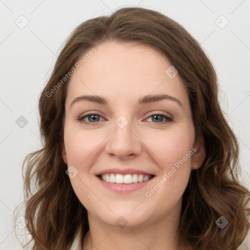 Joyful white young-adult female with long  brown hair and green eyes