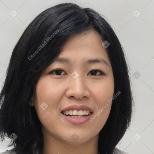 Joyful asian young-adult female with medium  black hair and brown eyes