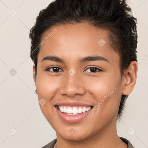 Joyful latino young-adult female with short  brown hair and brown eyes