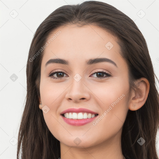 Joyful white young-adult female with long  brown hair and brown eyes