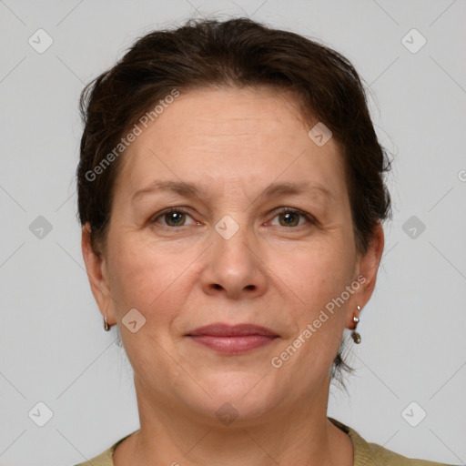 Joyful white adult female with short  brown hair and grey eyes