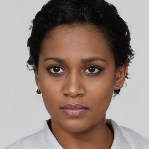 Neutral black young-adult female with short  black hair and brown eyes