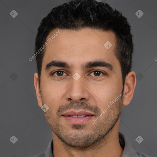 Joyful white young-adult male with short  black hair and brown eyes