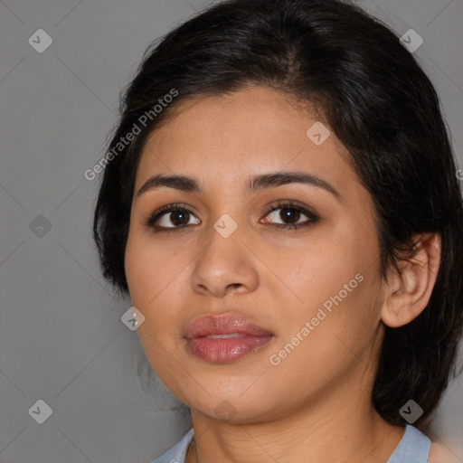 Joyful latino young-adult female with medium  brown hair and brown eyes