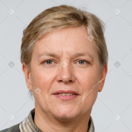 Joyful white adult female with short  brown hair and grey eyes