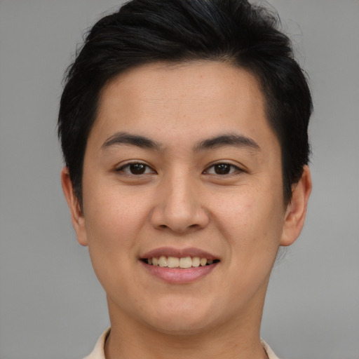 Joyful asian young-adult female with short  brown hair and brown eyes