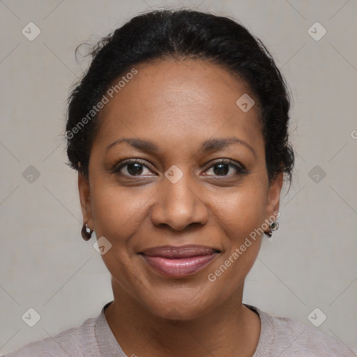 Joyful black adult female with short  brown hair and brown eyes