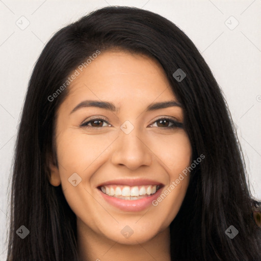 Joyful latino young-adult female with long  black hair and brown eyes