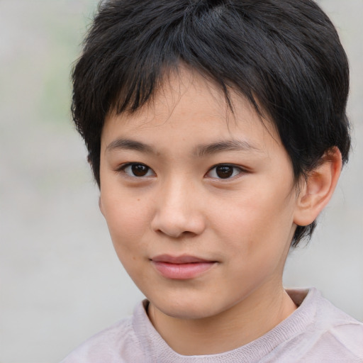 Joyful asian child female with short  brown hair and brown eyes