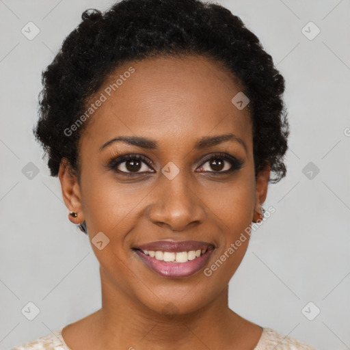 Joyful black young-adult female with short  black hair and brown eyes