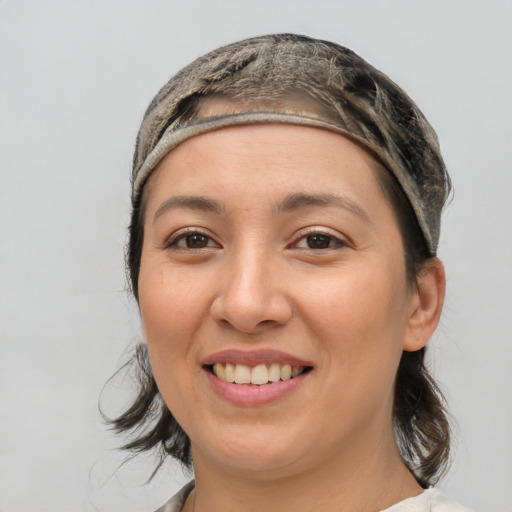 Joyful white young-adult female with medium  brown hair and brown eyes