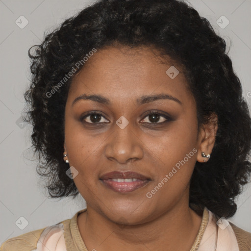 Joyful black young-adult female with medium  brown hair and brown eyes