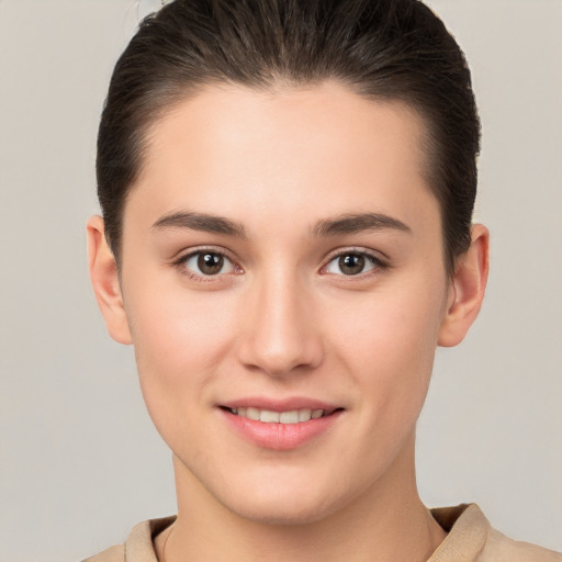 Joyful white young-adult female with short  brown hair and brown eyes