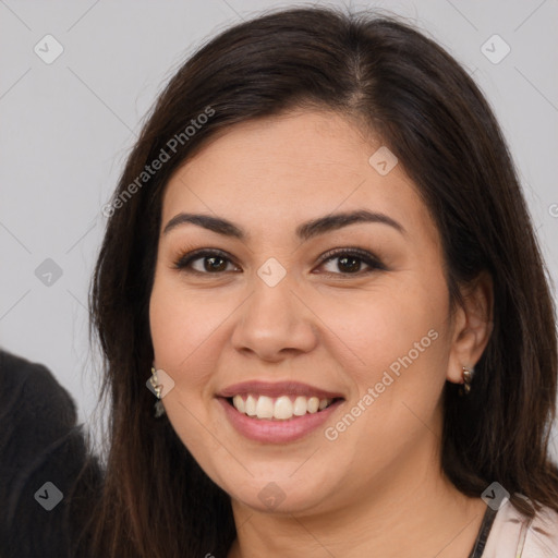 Joyful white young-adult female with long  brown hair and brown eyes