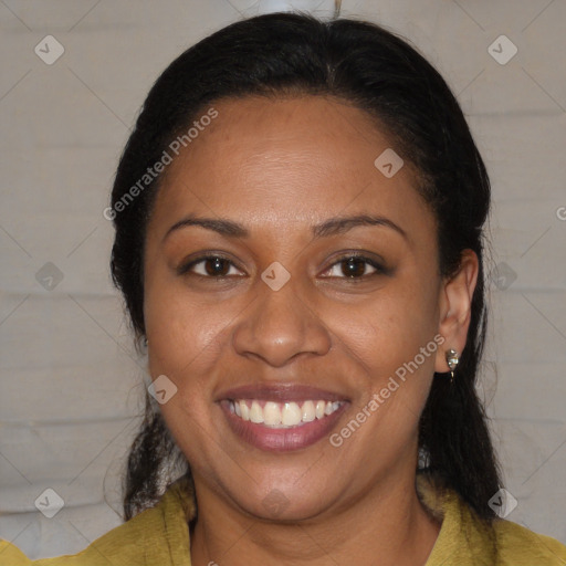 Joyful latino adult female with medium  brown hair and brown eyes