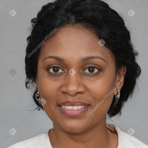 Joyful black adult female with medium  brown hair and brown eyes
