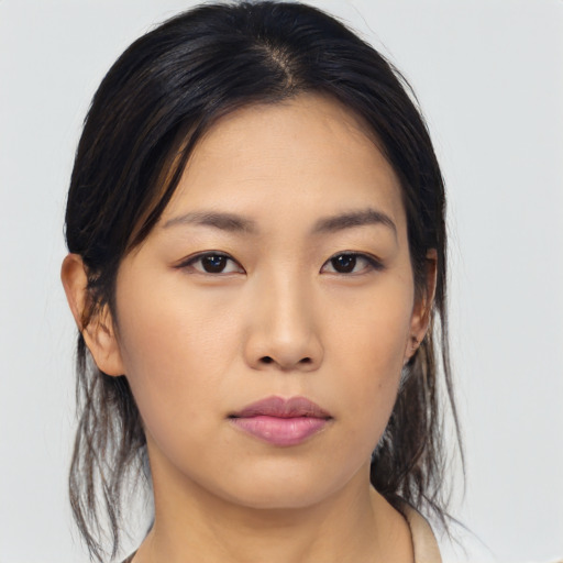 Neutral asian young-adult female with medium  black hair and brown eyes