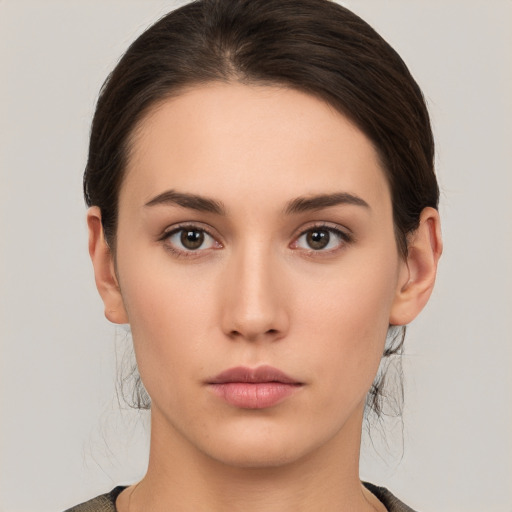 Neutral white young-adult female with medium  brown hair and brown eyes