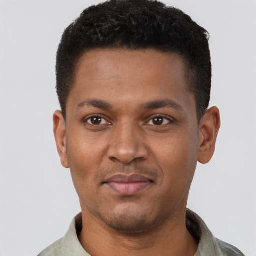 Joyful latino young-adult male with short  brown hair and brown eyes