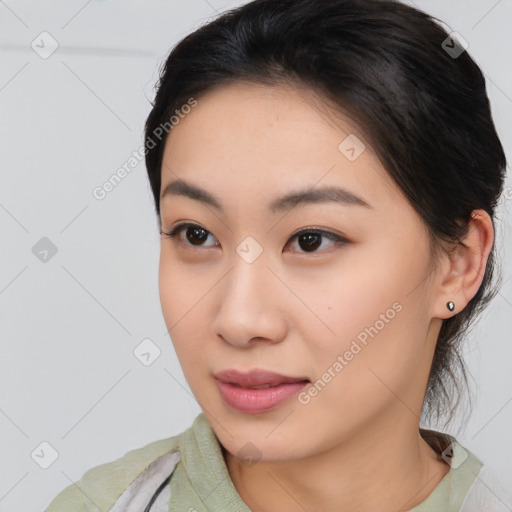 Joyful asian young-adult female with medium  brown hair and brown eyes