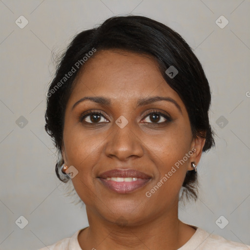 Joyful black adult female with medium  brown hair and brown eyes