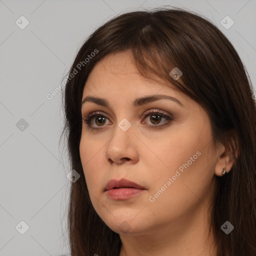 Neutral white young-adult female with long  brown hair and brown eyes