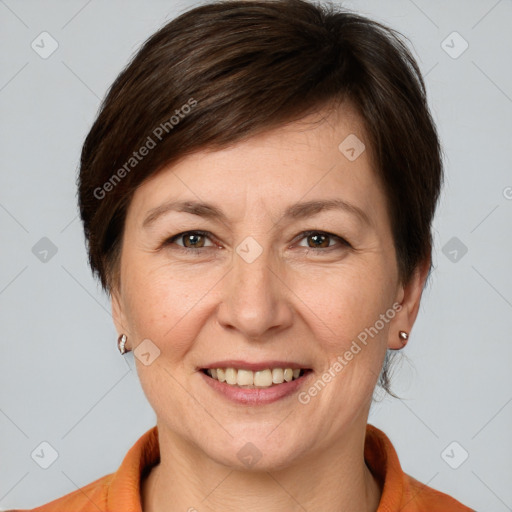 Joyful white adult female with medium  brown hair and brown eyes