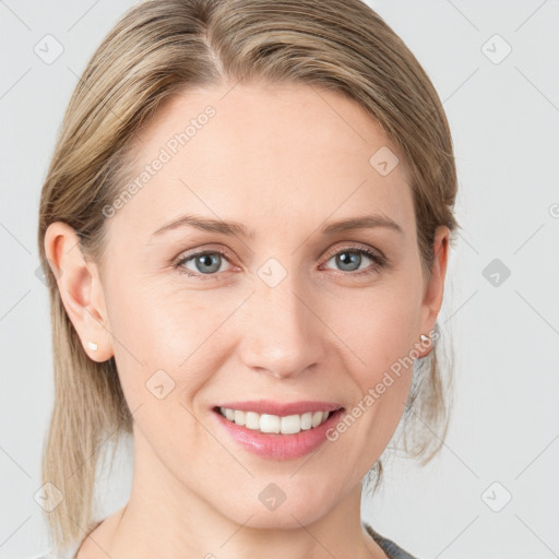 Joyful white young-adult female with medium  brown hair and blue eyes