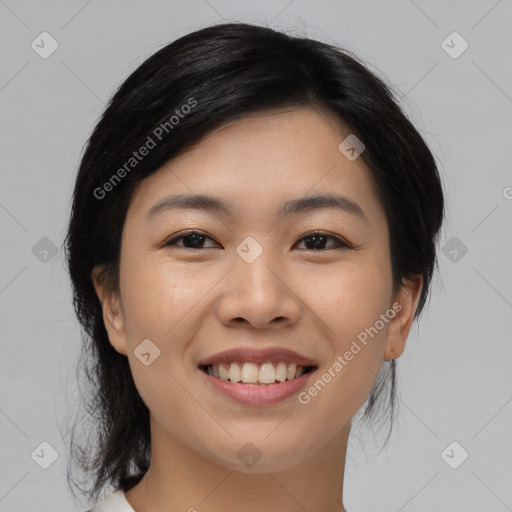 Joyful asian young-adult female with medium  black hair and brown eyes