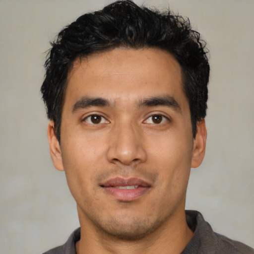 Neutral latino young-adult male with short  black hair and brown eyes