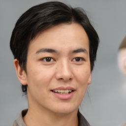 Joyful white young-adult male with medium  brown hair and brown eyes