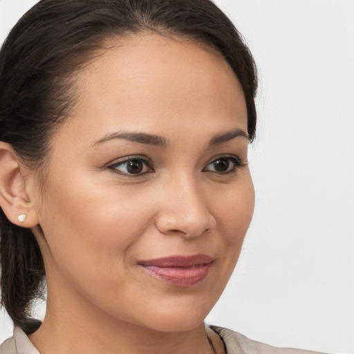 Joyful white young-adult female with medium  brown hair and brown eyes