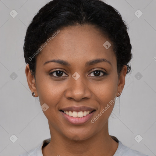 Joyful latino young-adult female with short  black hair and brown eyes