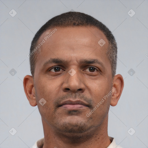 Neutral latino young-adult male with short  brown hair and brown eyes