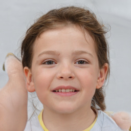 Joyful white child female with short  brown hair and brown eyes