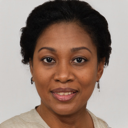 Joyful latino adult female with short  black hair and brown eyes