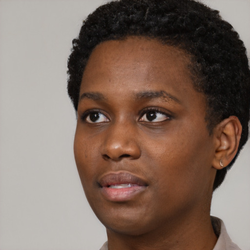 Neutral black young-adult female with short  black hair and brown eyes