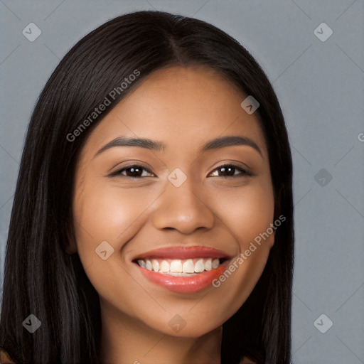 Joyful latino young-adult female with long  brown hair and brown eyes