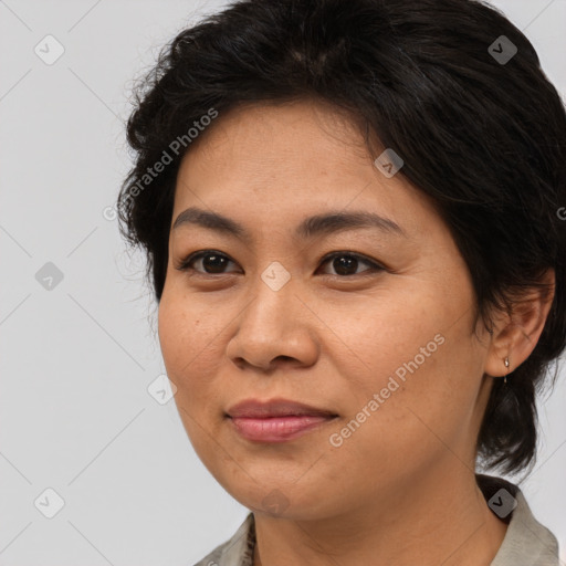 Joyful asian adult female with medium  brown hair and brown eyes