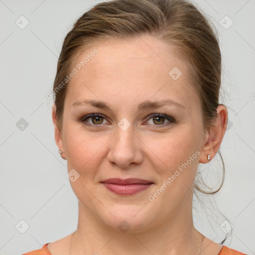 Joyful white young-adult female with medium  brown hair and blue eyes