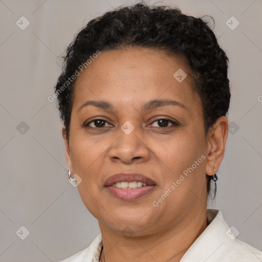 Joyful black adult female with short  brown hair and brown eyes