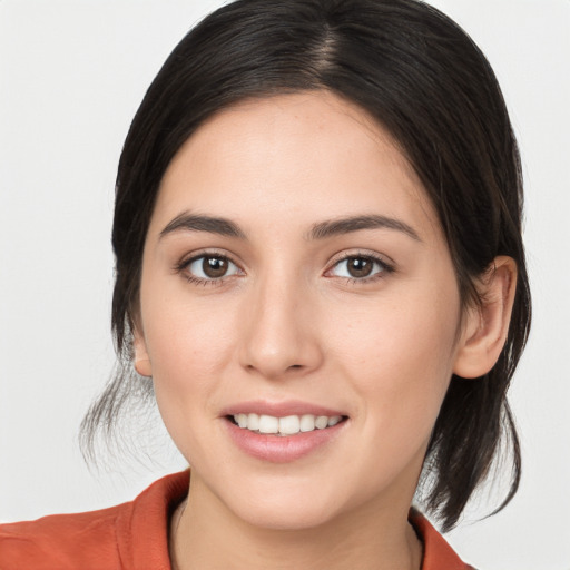 Joyful white young-adult female with medium  brown hair and brown eyes