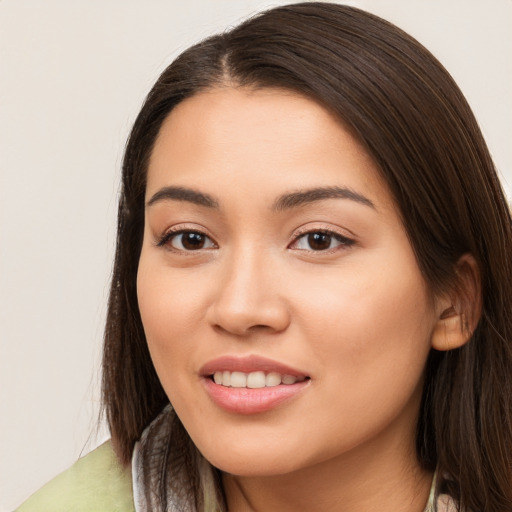 Joyful white young-adult female with long  brown hair and brown eyes